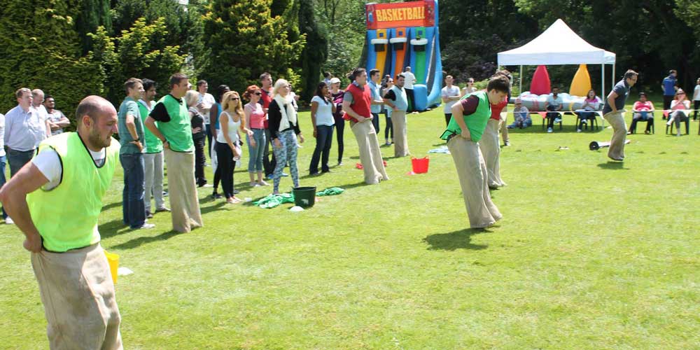 People taking part in a sack race
