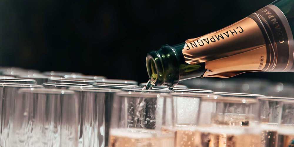 A bottle of prosecco being poured